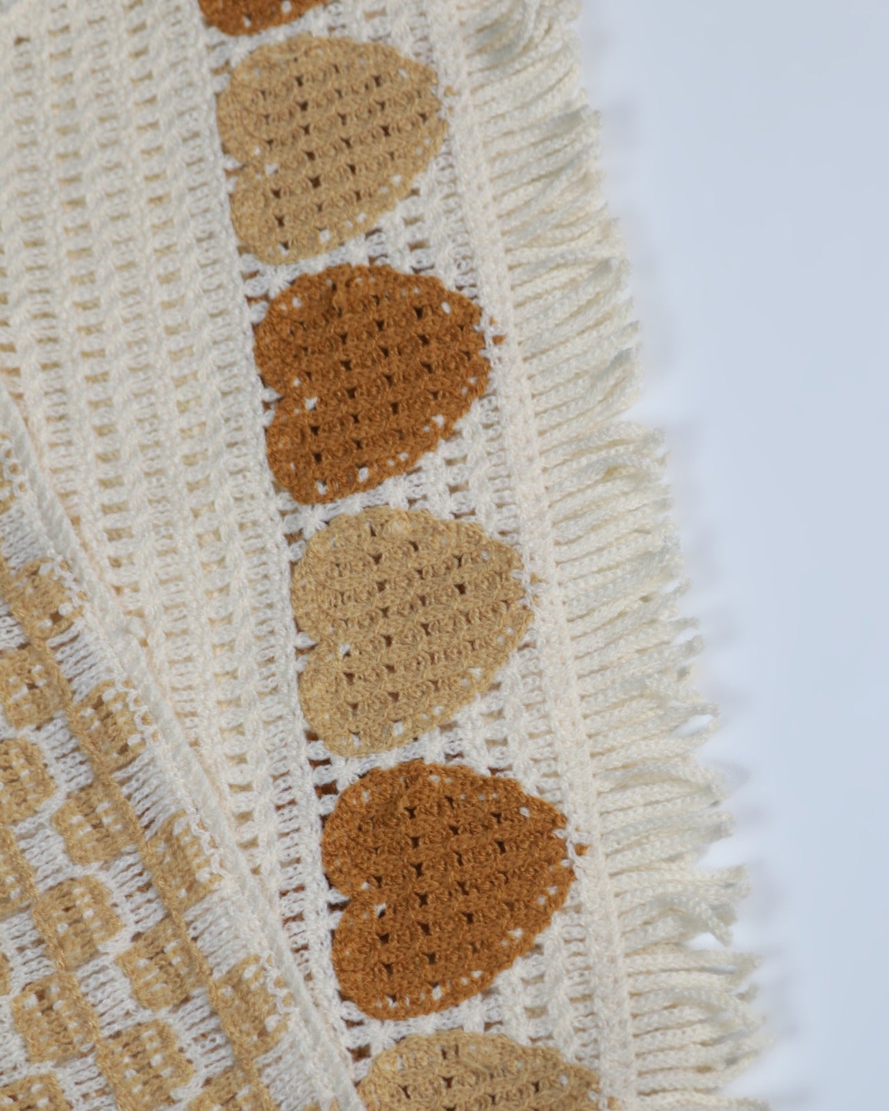 Boho Heart Crochet Knit Crop Top | Handmade Aesthetic Summer Wear close-up featuring crochet heart motifs and fringed hem.