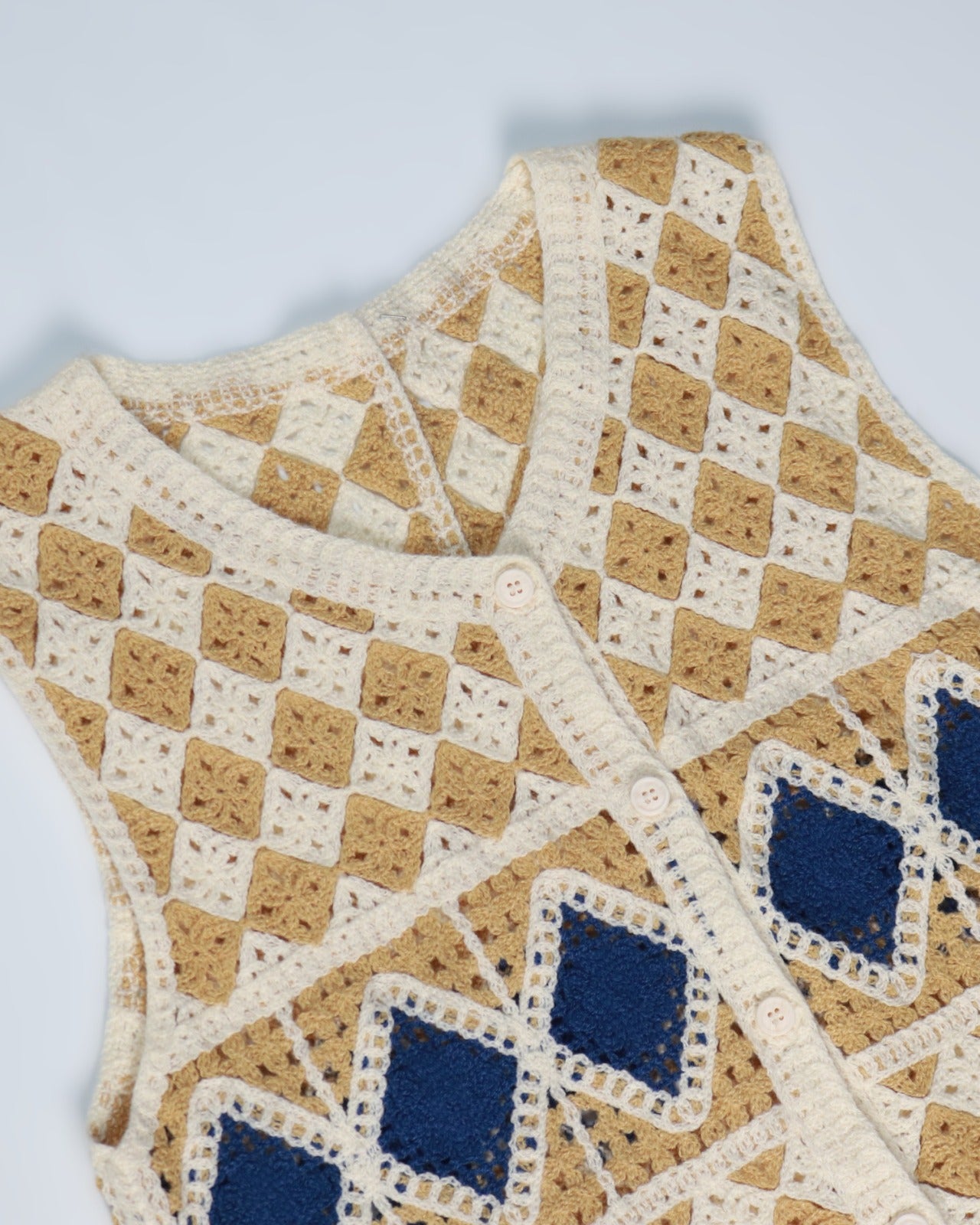 Handcrafted Diamond Crochet Vest featuring unique beige and white diamond patterns with blue accents.
