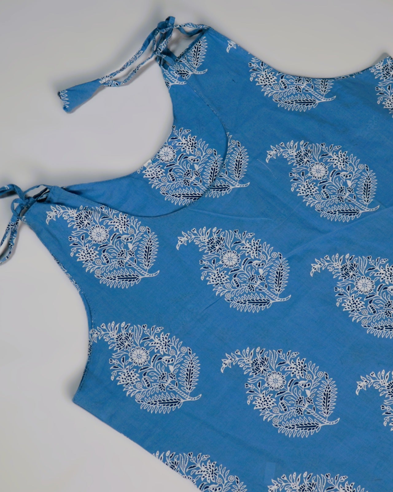 Blue Peacock Print Cotton Slip Dress for Women, showcasing elegant blue design and adjustable tie straps.